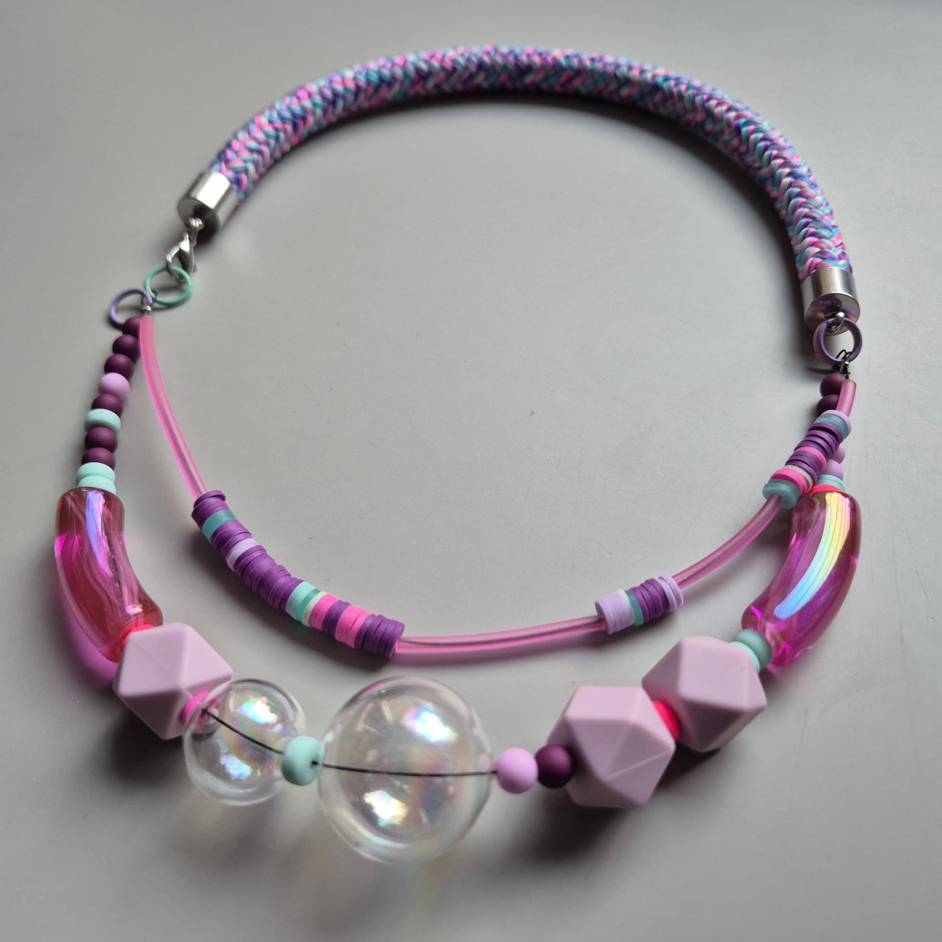 Two-strand necklace with large iridescent bubble glass spheres and pink translucent tubes