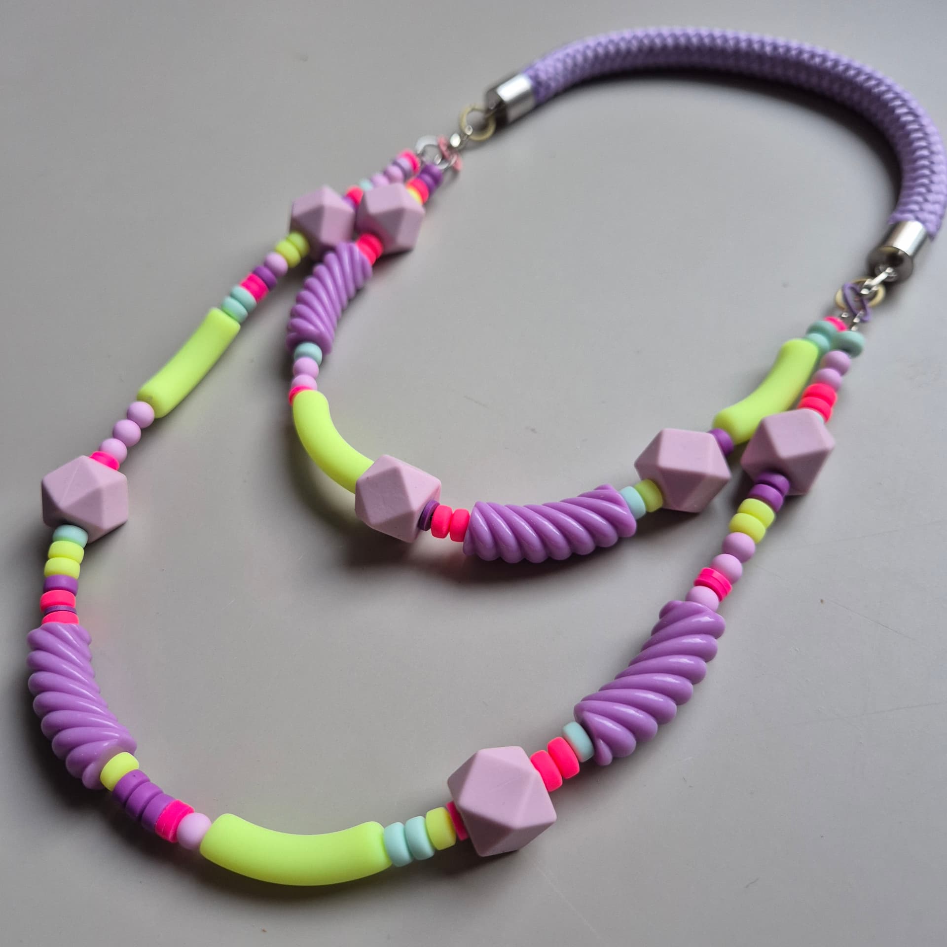 Long pastel necklace with ribbed lilac beads, neon yellow tubes and mint discs